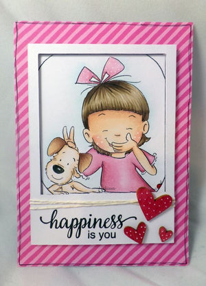 Little girl playing trick on her puppy taking a selfie greeting card example